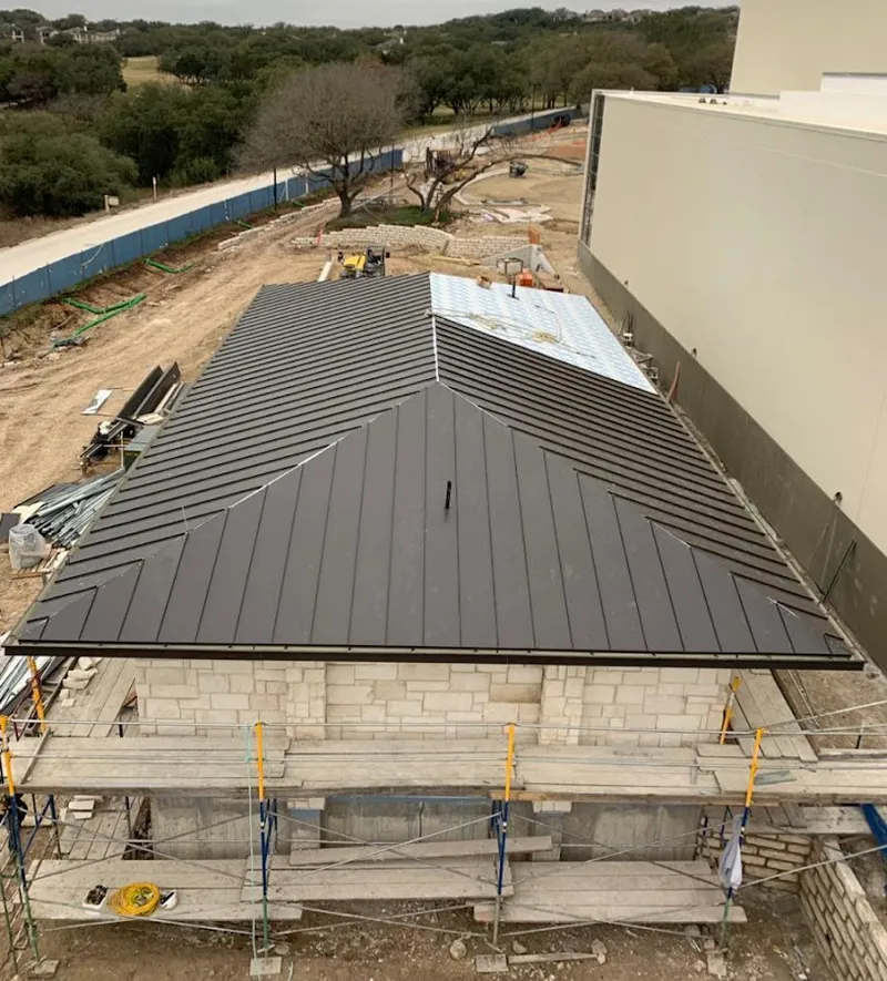 Metal roof new construction with scaffolding in West Warwick